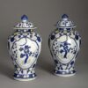 Pair of polychrome vases and covers