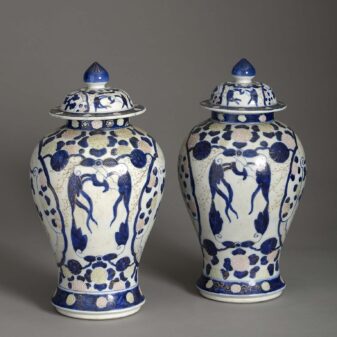 Pair of polychrome vases and covers