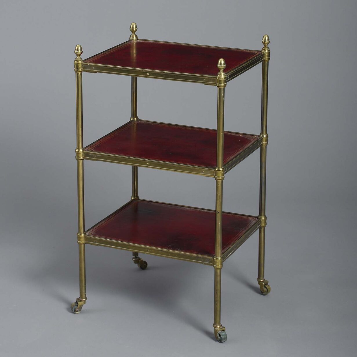 Red leather and brass etagere