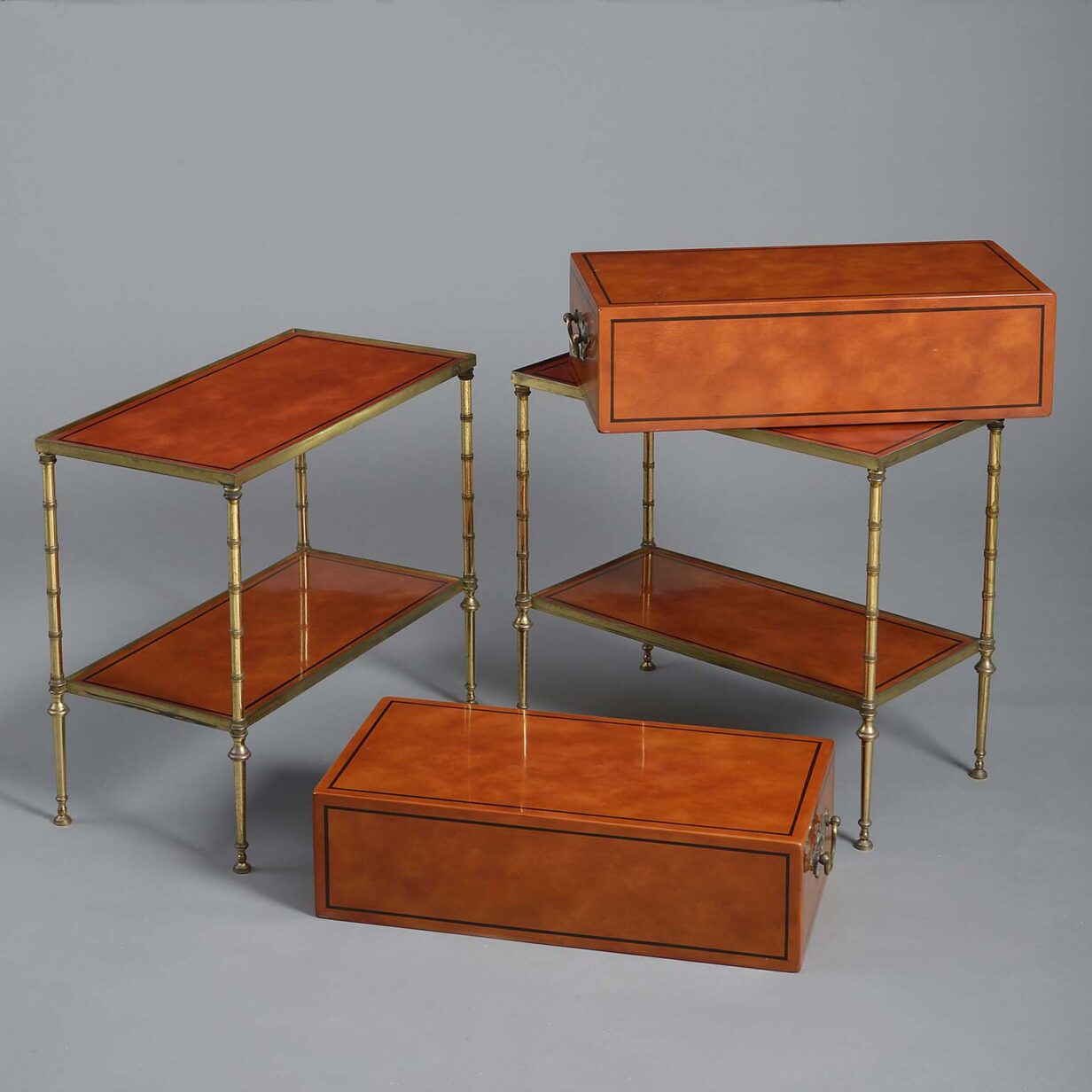 Pair of 20th century metamorphic lacquer & brass end tables