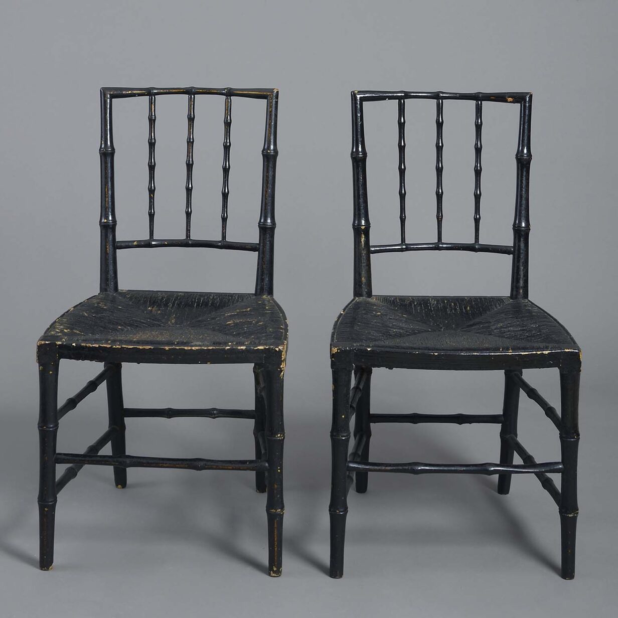 Pair of ebonised chairs