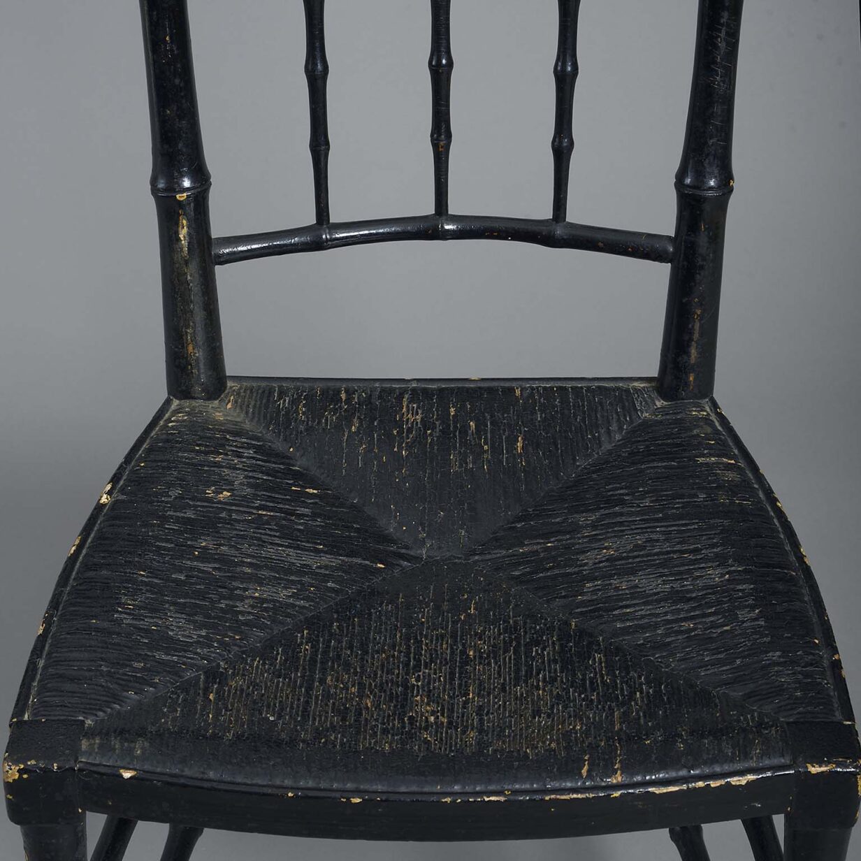 Pair of ebonised chairs