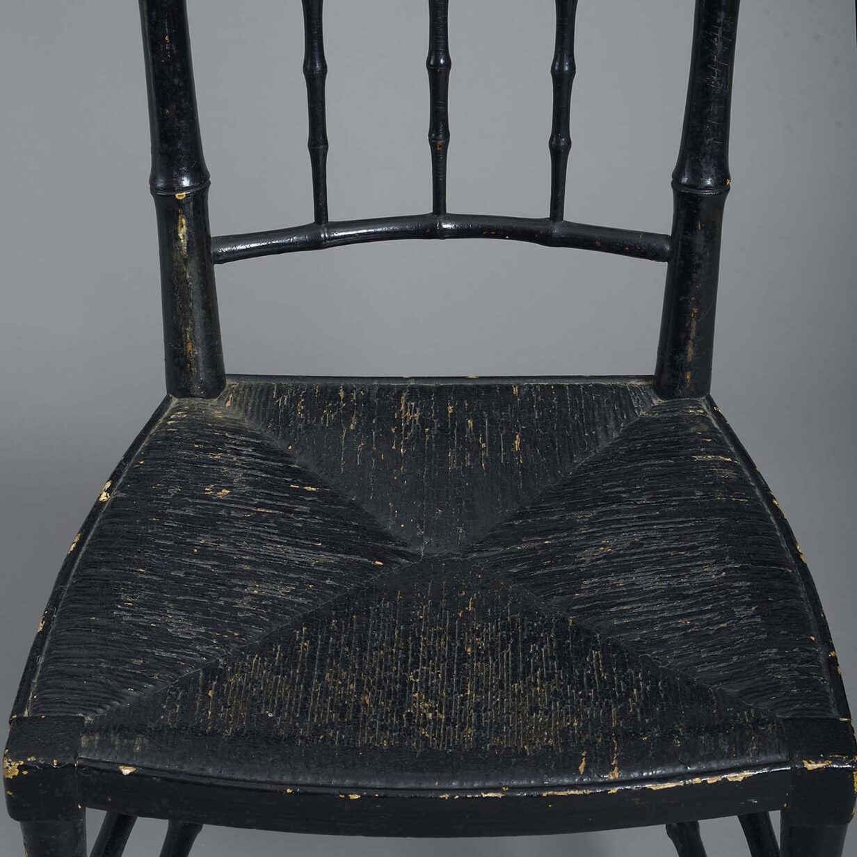 Pair of ebonised chairs