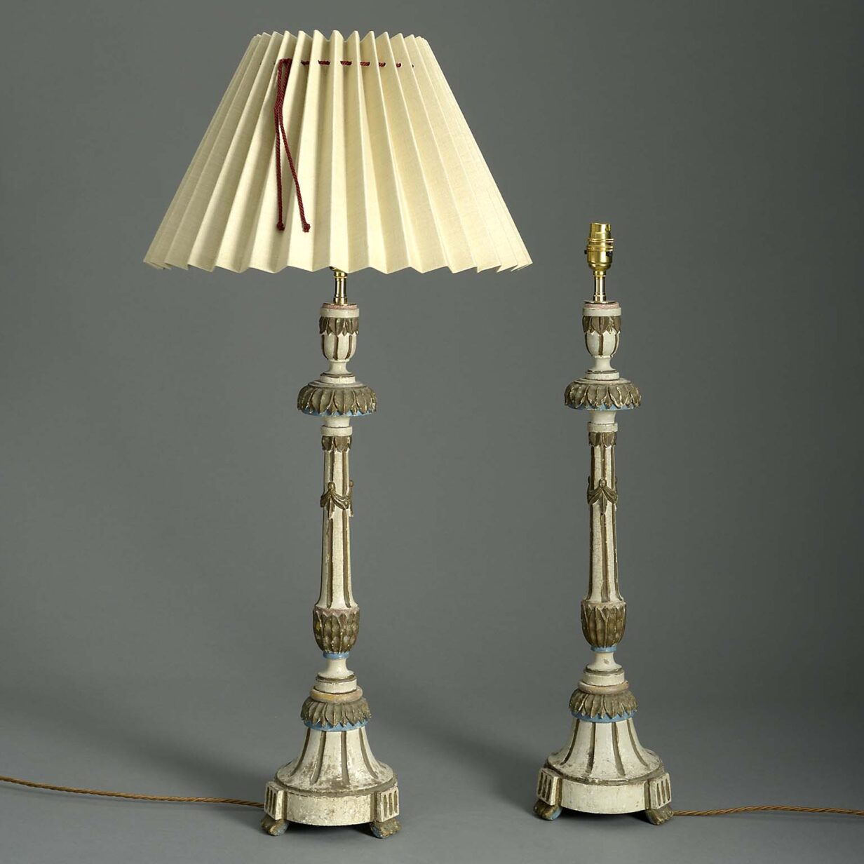 Pair of carved candlestick lamps