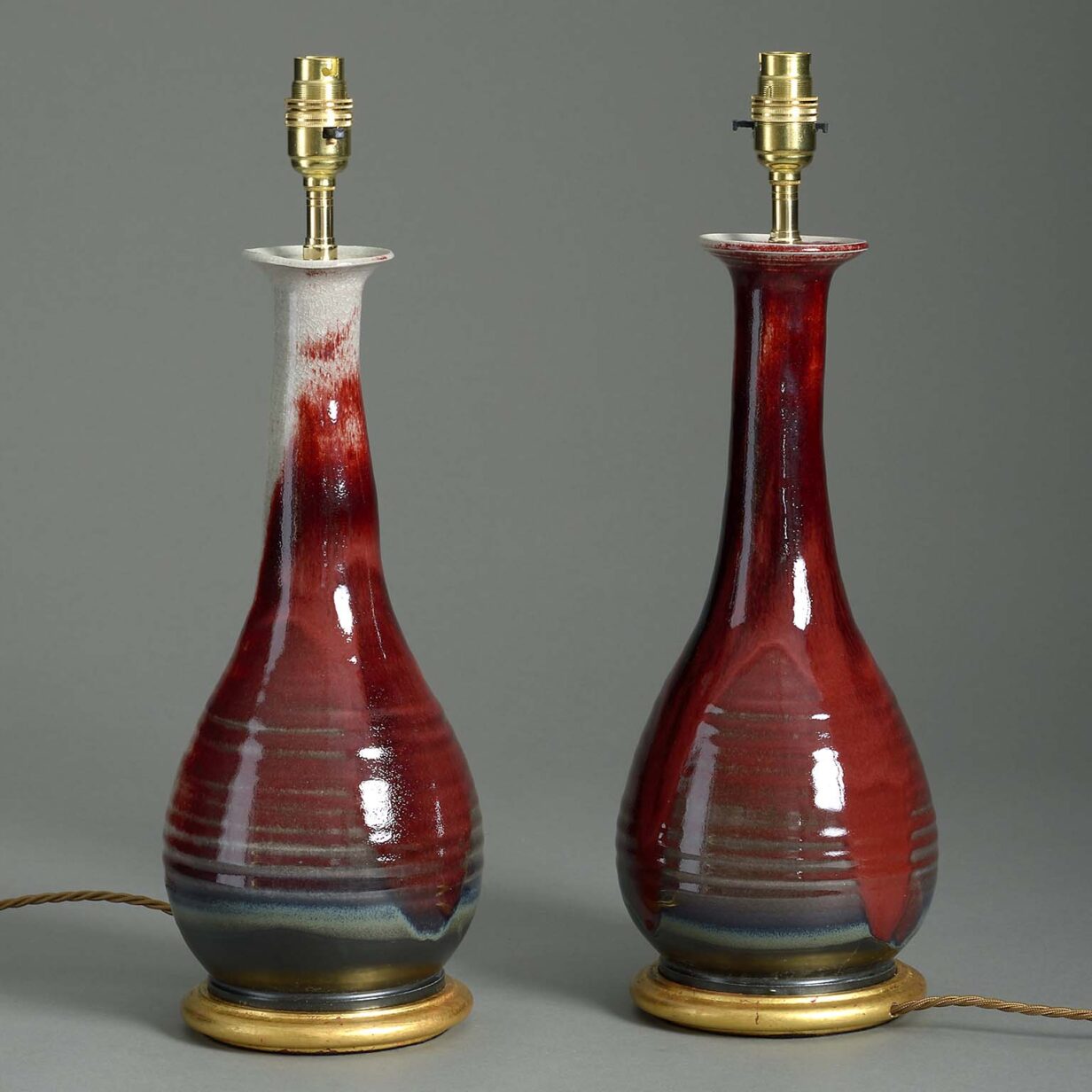 Pair of studio pottery sang de boeuf glazed art vase lamps