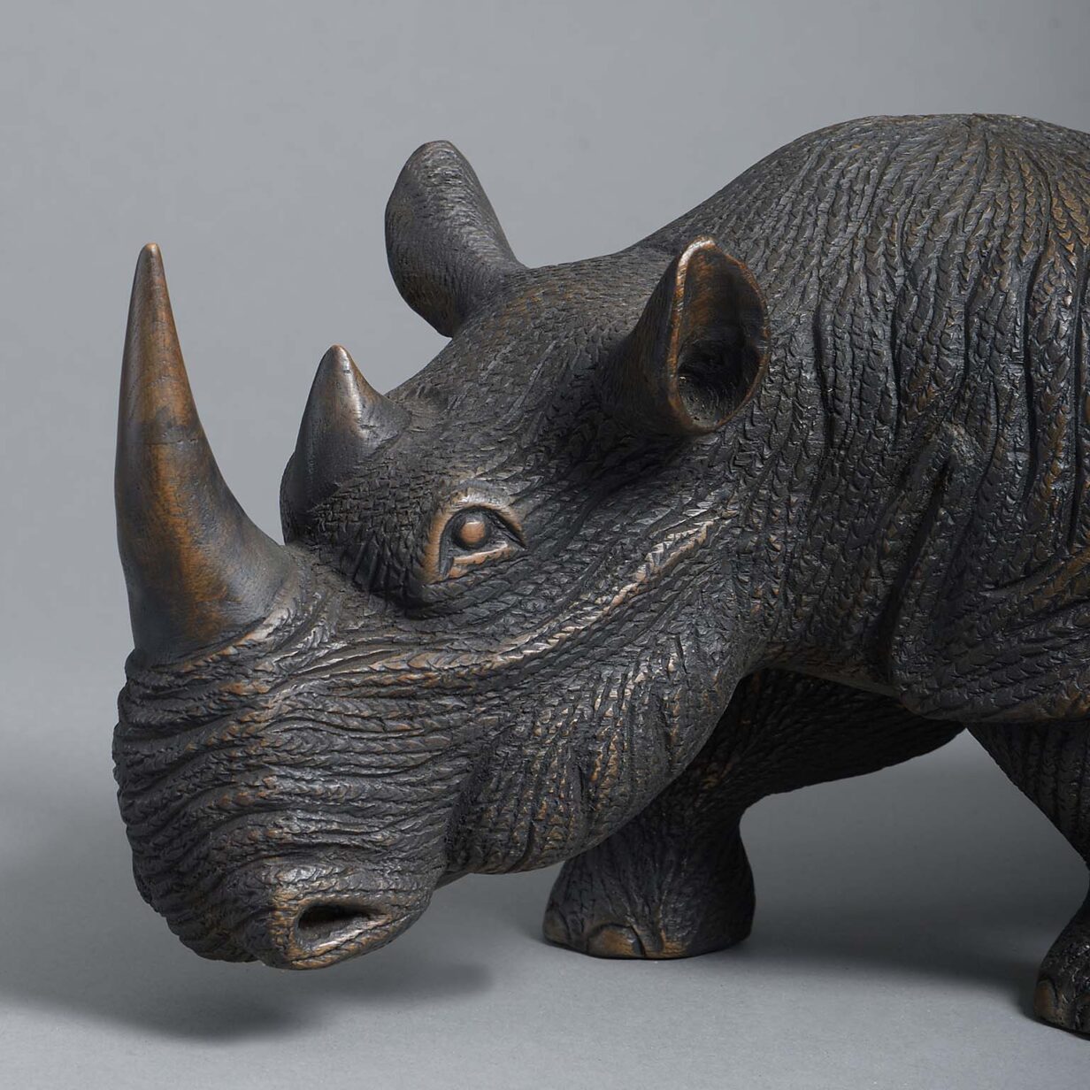 Carved hardwood rhinoceros sculpture