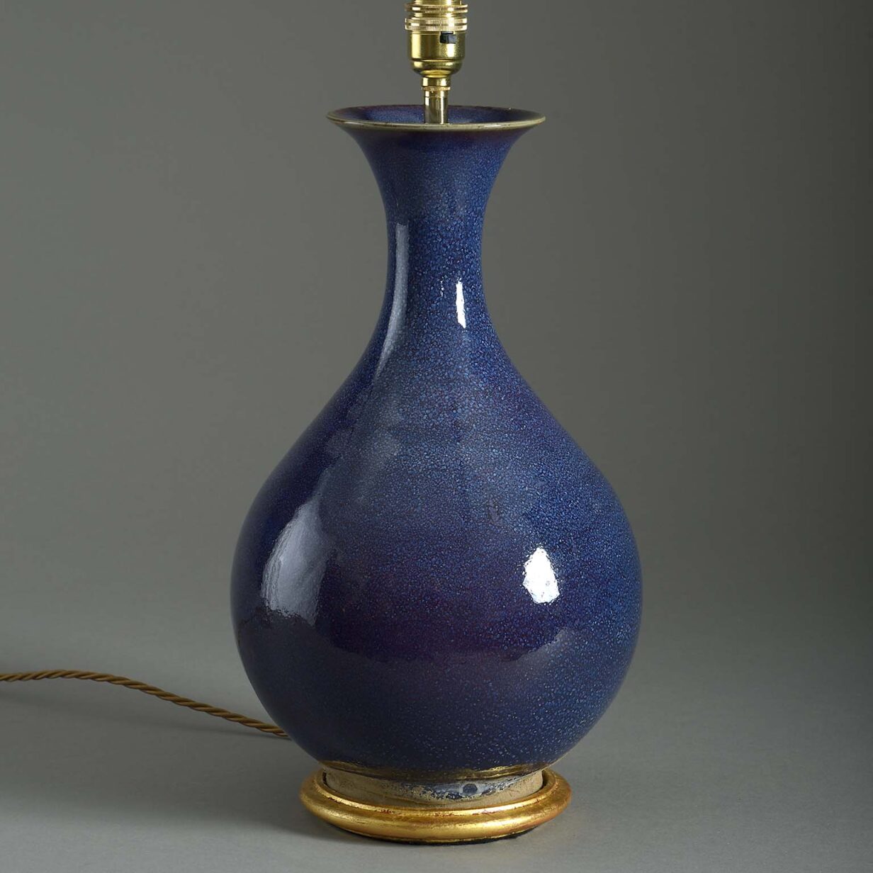 A purple glazed vase lamp