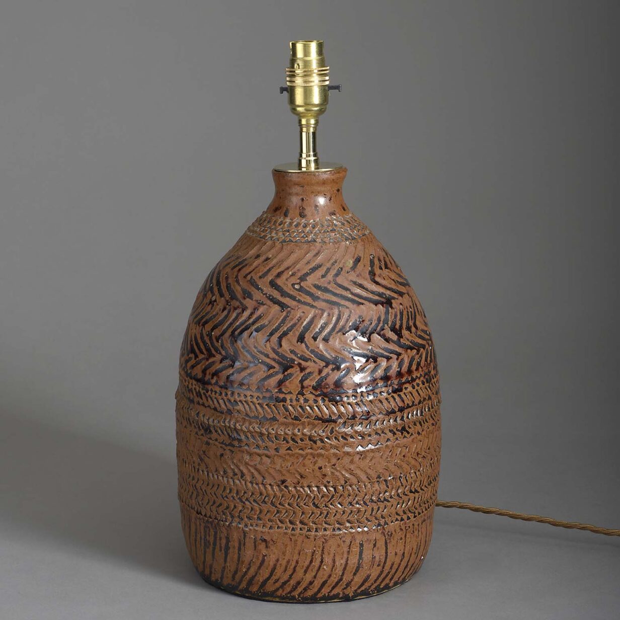 Incised terracotta vase lamp