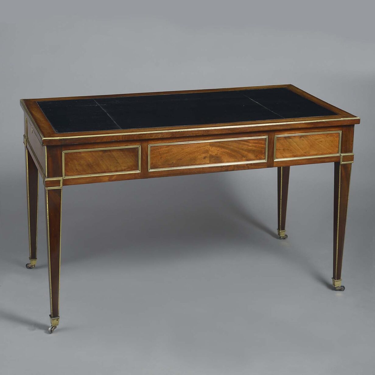 Louis xvi period mahogany and brass mounted writing table