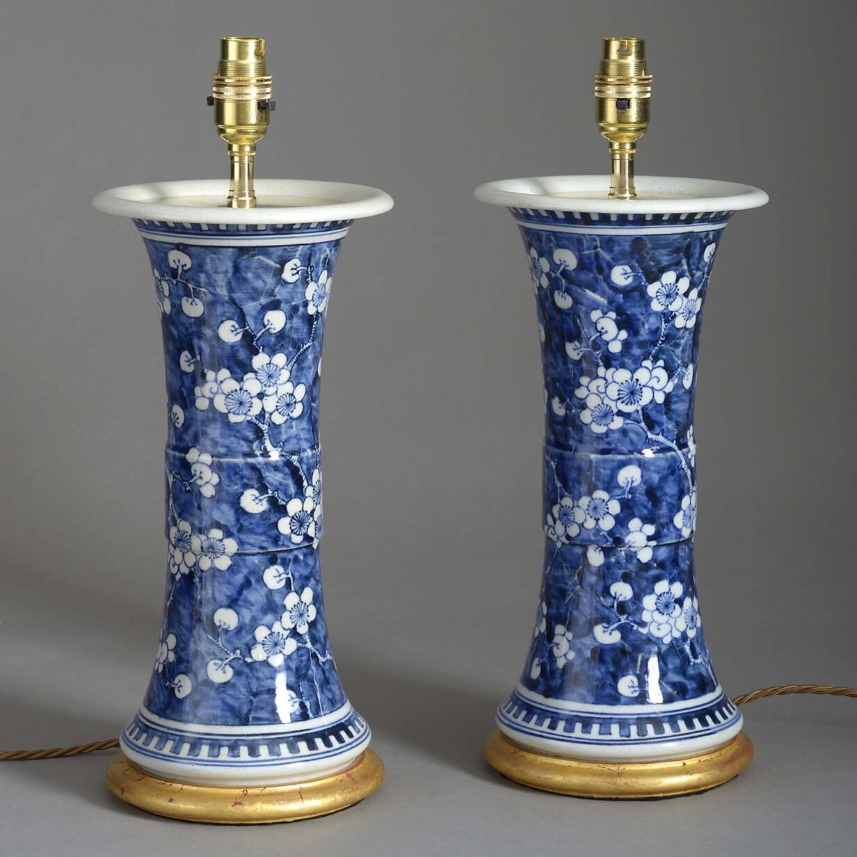 Pair of blue and white beaker vase lamps