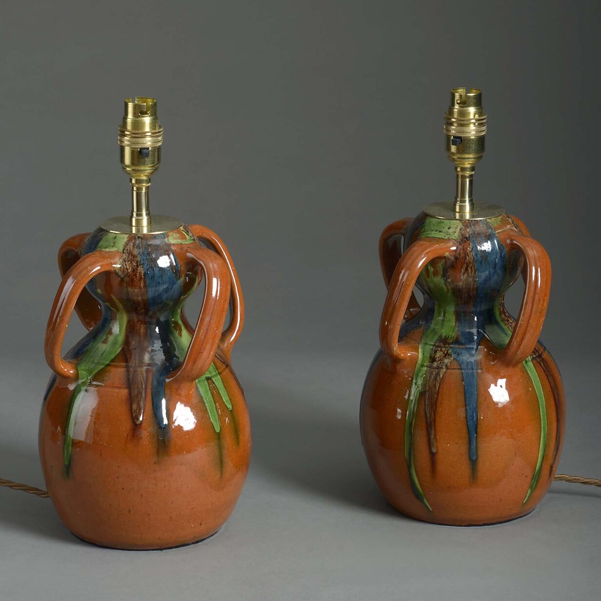 Pair of 20th century slop glazed pottery vase lamps