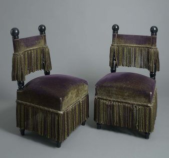 Pair of mid-20th century ebonised salon chairs in the manner of carlo bugatti