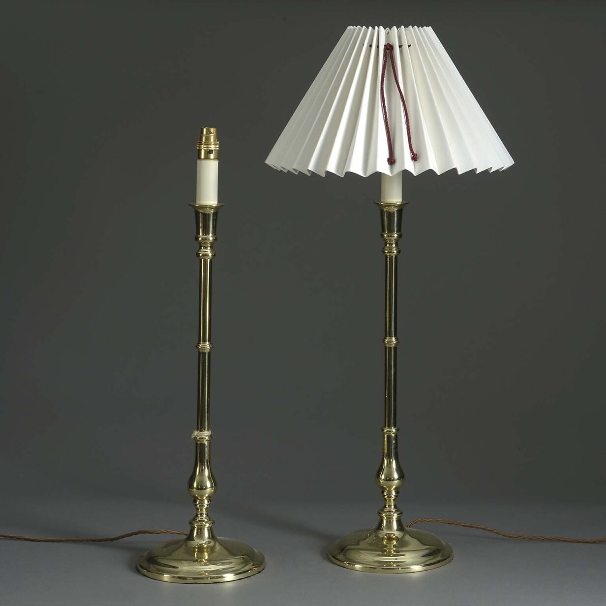Pair of tall brass candlestick lamps