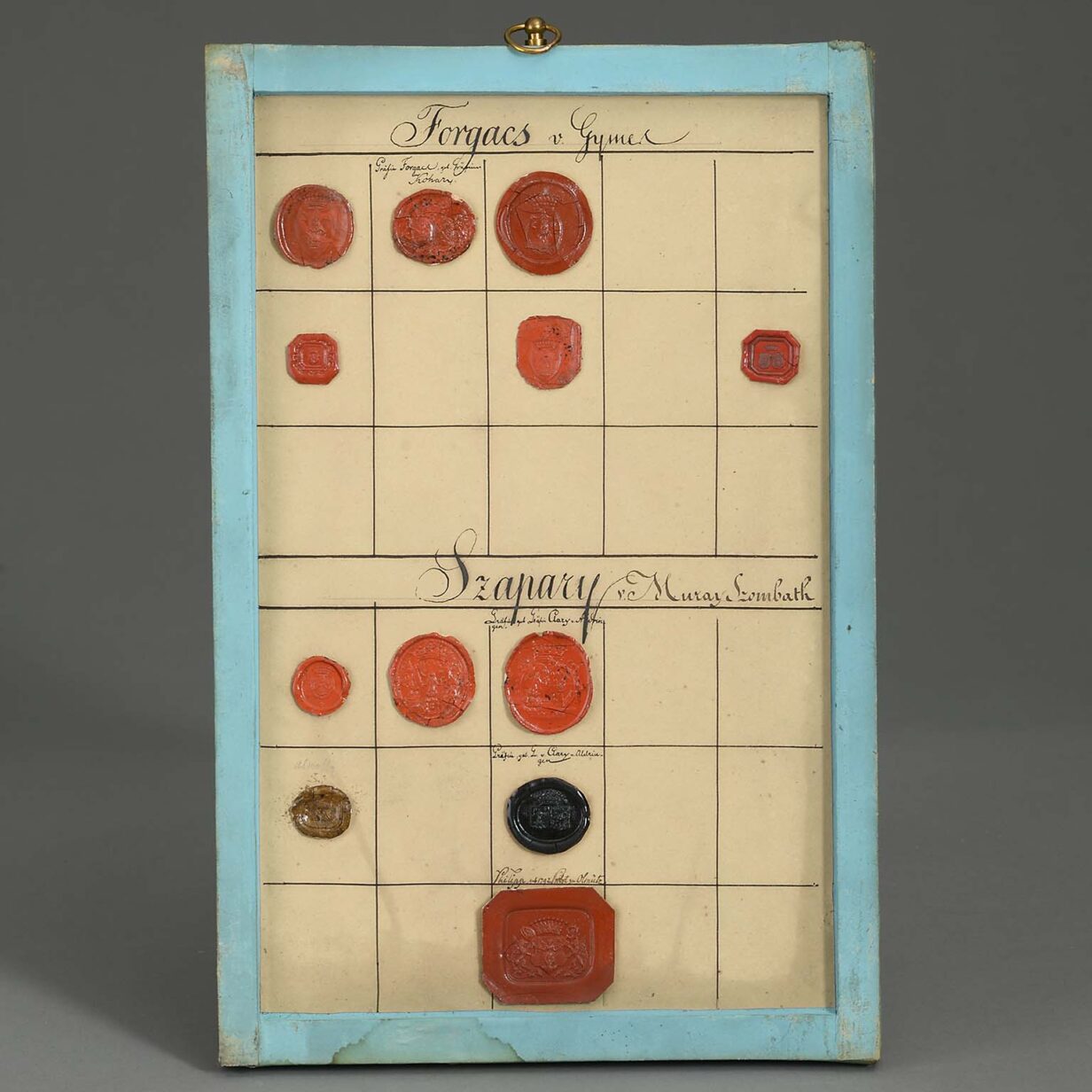 Group of four 18th century panels containing heraldic wax seals