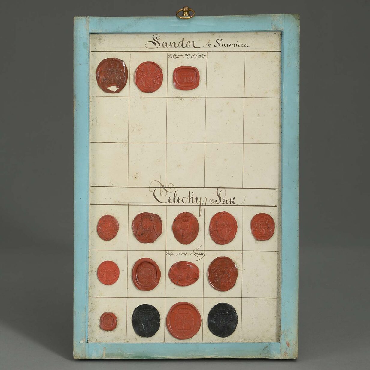 Group of four 18th century panels containing heraldic wax seals