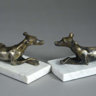 Pair of bronze whippets on marble plinths