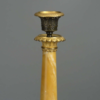 Pair of early 19th century empire period siena marble candlesticks