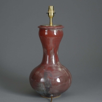 Early 20th century red glazed pottery vase lamp