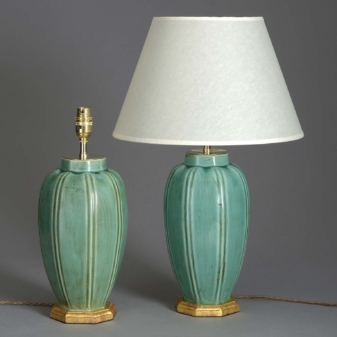 Pair of antique green glazed lamps