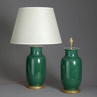 Pair of antique green glazed lamps