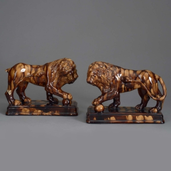 Pair of staffordshire pottery lions